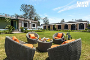 Arcadian Manor with Indoor Pool Indoor-Outdoor Games at Varanasi by StayVista
